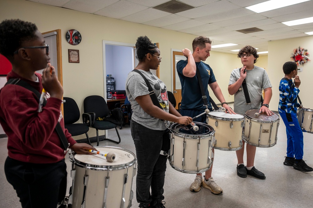 Stick Masters teach Sailors to play percussion instruments