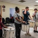 Stick Masters teach Sailors to play percussion instruments