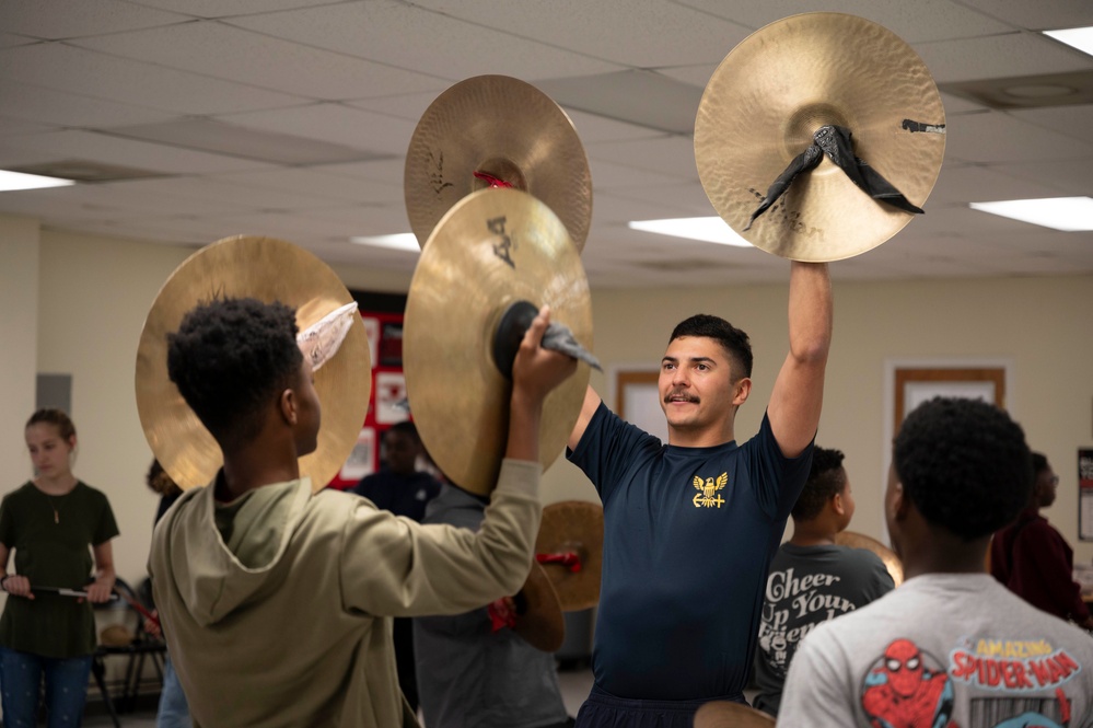 Stick Masters teach Sailors to play percussion instruments