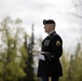 Alaska Army National Guardsman plays Taps during memorial service