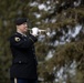 Alaska Army National Guardsman plays Taps during memorial service