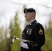 Alaska Army National Guardsman plays Taps during memorial service