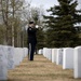 Alaska Army National Guardsman plays Taps during memorial service