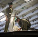 Marines Conduct Aircraft Maintenance On USS Iwo Jima