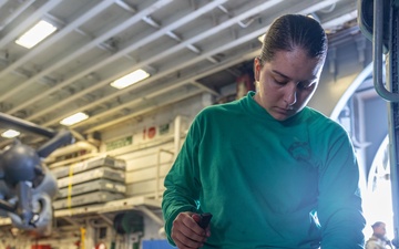 Marines Conduct Aircraft Maintenance On USS Iwo Jima