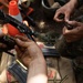 U.S. Marines and Guatemalan Infantrymen loading magazines
