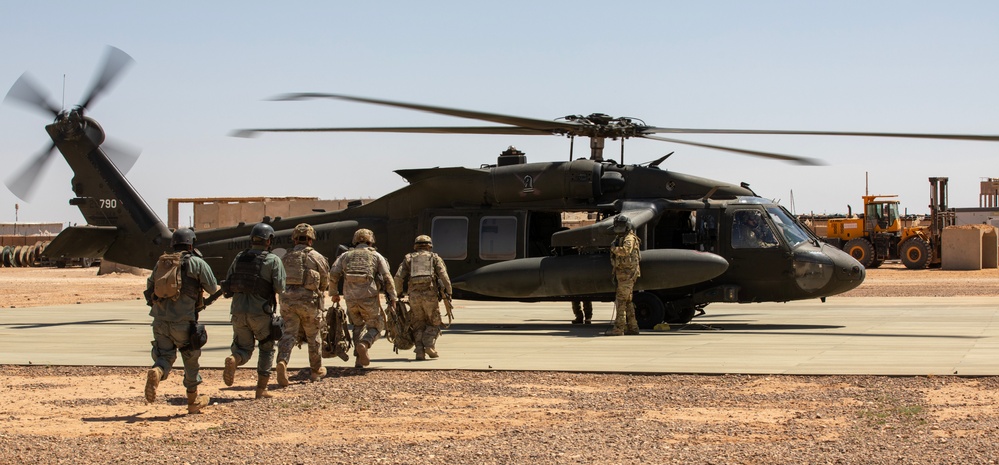 Syrian Partners and 10th Mountain Infantrymen Board Black Hawk During Joint Air Assault Training