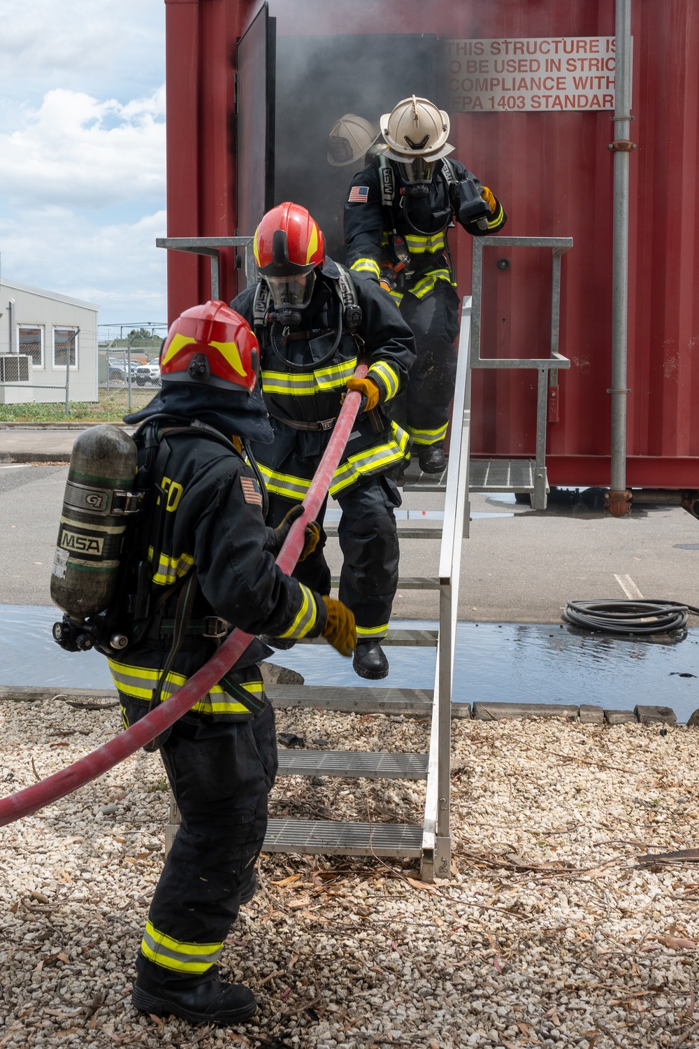 Firefighters conduct structural live fire training