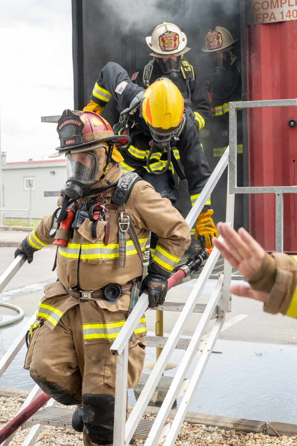 Firefighters conduct structural live fire training
