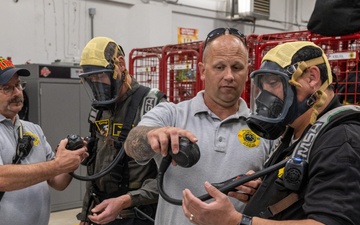 Firefighters conduct structural live fire training