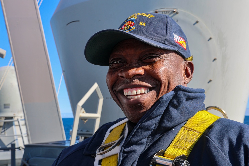 Interior Communications Specialist 2nd Class Paul Anato performs maintenance aloft