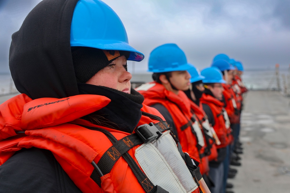 Seaman Angel Arends mans the rails before an underway replenishment on the USS Bulkeley