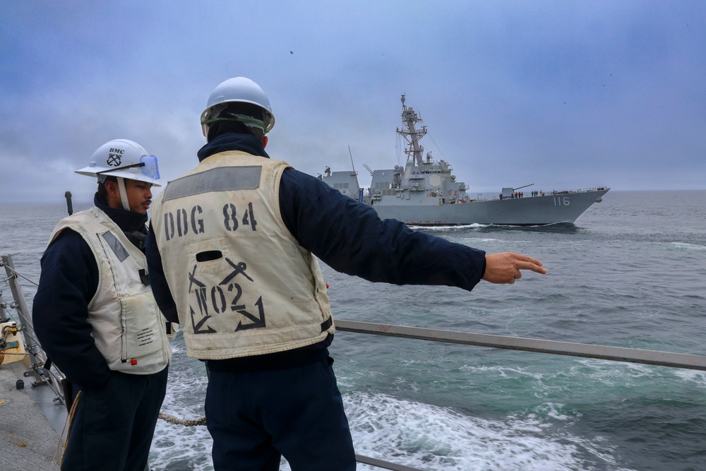 Boatswain’s Mates coordinate with the midship fuel replenishment team for an underway replenishment