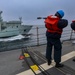 Gunner’s Mates use an M-14 rifle to send a phone and distance line to the Royal Canadian Navy replenishment oiler MV Asterix