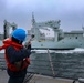 Gunner’s Mate Seaman Trinity Anderson discharges an M-14 rifle to send a phone and distance line to the Royal Canadian Navy replenishment oiler MV Asterix for an underway replenishment