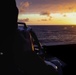U.S. Navy Sailor takes a solar azimuth reading with a sextant