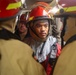 Damage Controlman 3rd Class Michael Manio provides instruction to the primary attack team