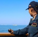Lt. j.g. Sarah Skinner observes a live fire exercise alongside NATO vessels