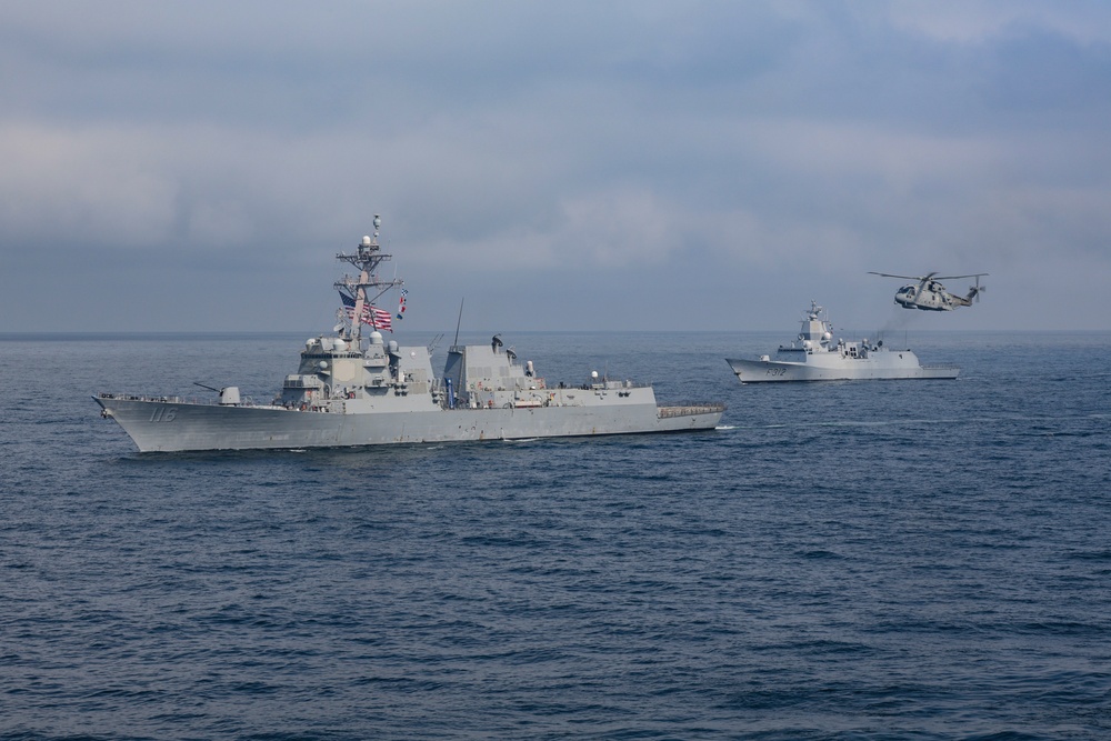 USS Thomas Hudner DDG (116), maneuvers alongside the Royal Norwegian Royal Navy Fridtjof Nansen-class frigate HNoMS Otto Sverdrup (F312)