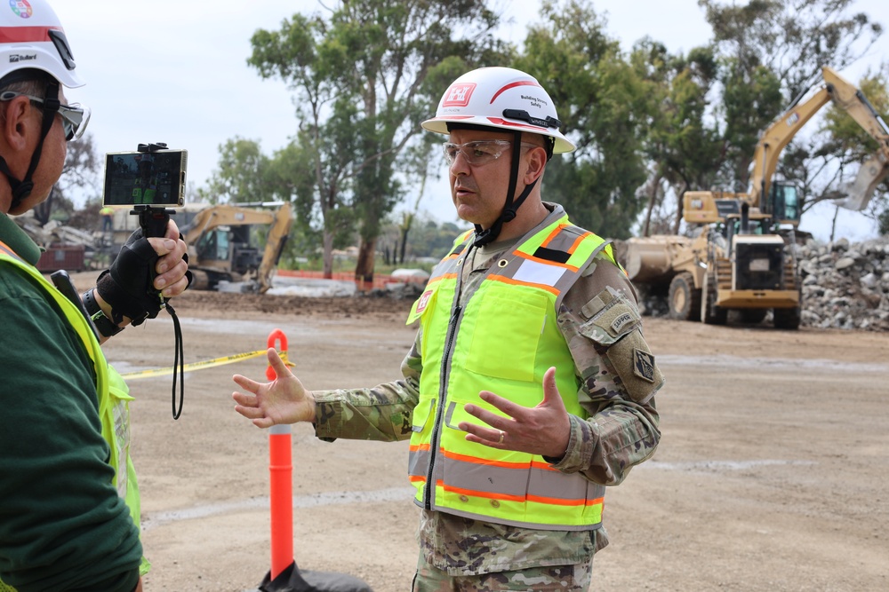 Col. Palazzini speaks to a reporter about the Temporary Debris Staging and Reduction area