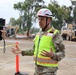 Col. Palazzini speaks to a reporter about the Temporary Debris Staging and Reduction area