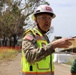 Col. Palazzini speaks to a reporter about the Temporary Debris Staging and Reduction area