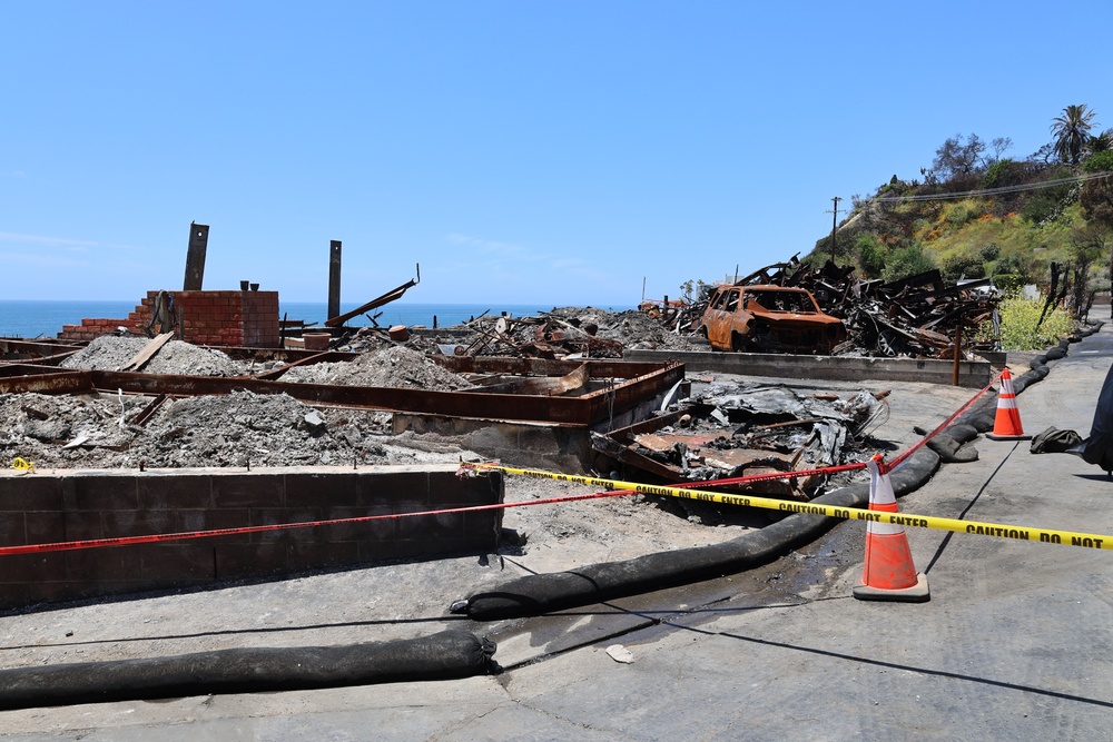Debris clearing on Rambla Vista.