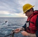 Sailor Observes Boat Operations
