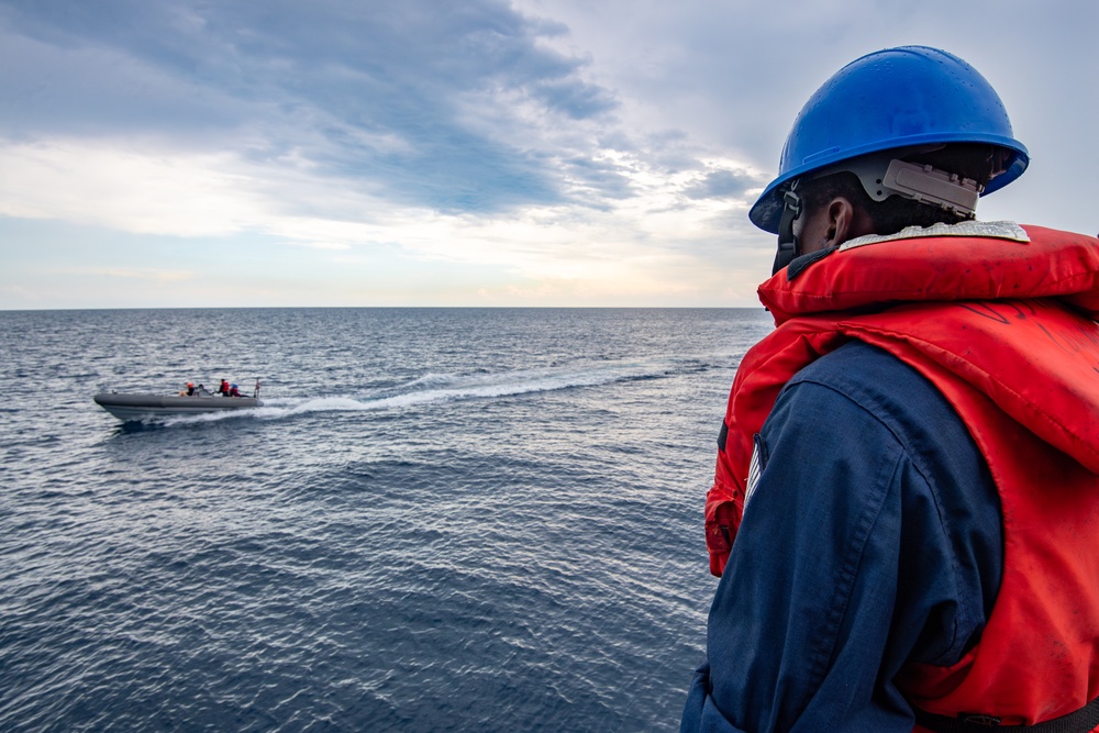 Sailor Observes Boat Operations