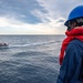 Sailor Observes Boat Operations