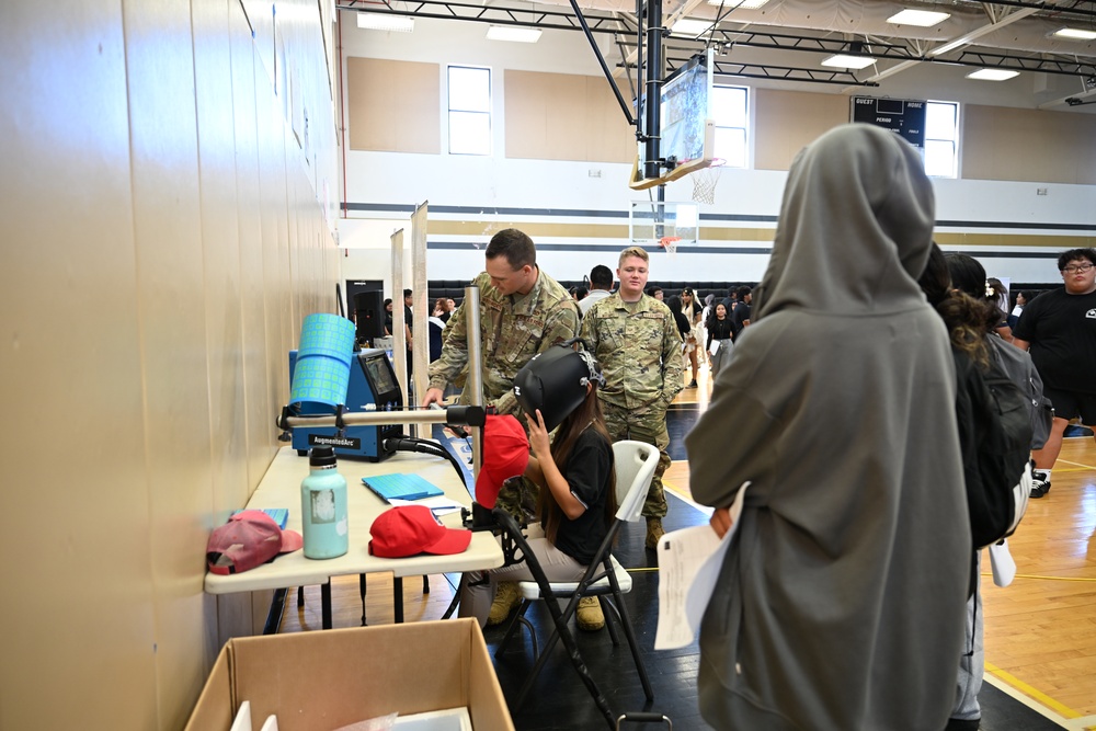 Team Andersen Airmen volunteered at the Tiyan High School Transportation, Logistics, and Construction Boot Camp
