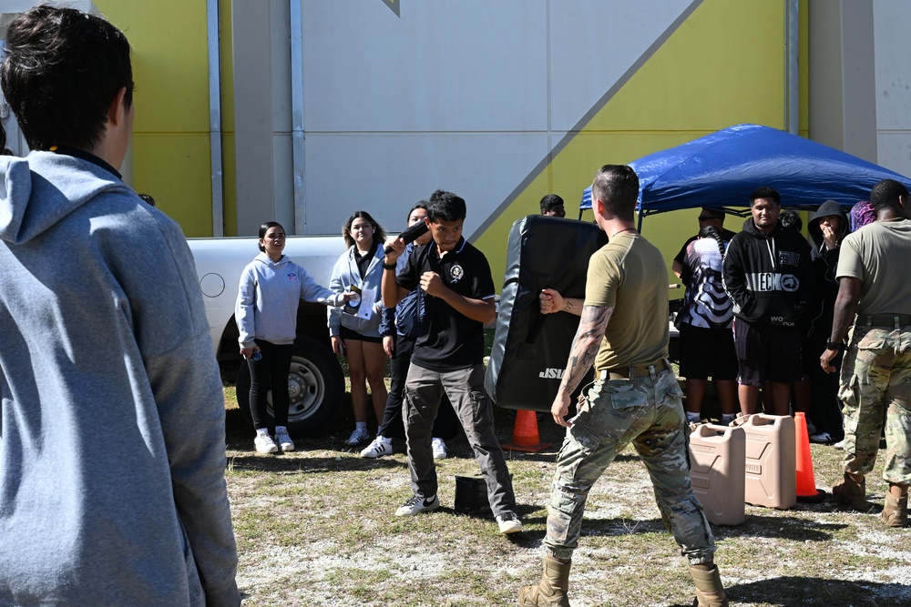 Team Andersen Airmen volunteered at the Tiyan High School Transportation, Logistics, and Construction Boot Camp