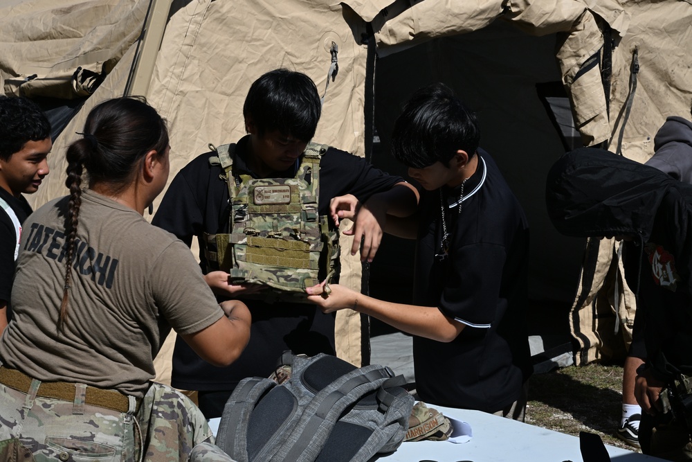 Team Andersen Airmen volunteered at the Tiyan High School Transportation, Logistics, and Construction Boot Camp