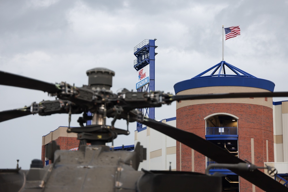 An AH-64D sits outside NBT Bank Stadium