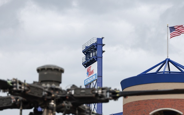 An AH-64D sits outside NBT Bank Stadium