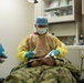 USS Ronald Reagan Sailor performs Dental Check-up