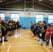 Capt. Alena Leshchyk, left, commander of the 5th Transportation Company commander, along with Soldiers from her unit, welcome the Yokohama Higashi Little League team to an inaugural sports exchange event May 6 at Yokohama North Dock.