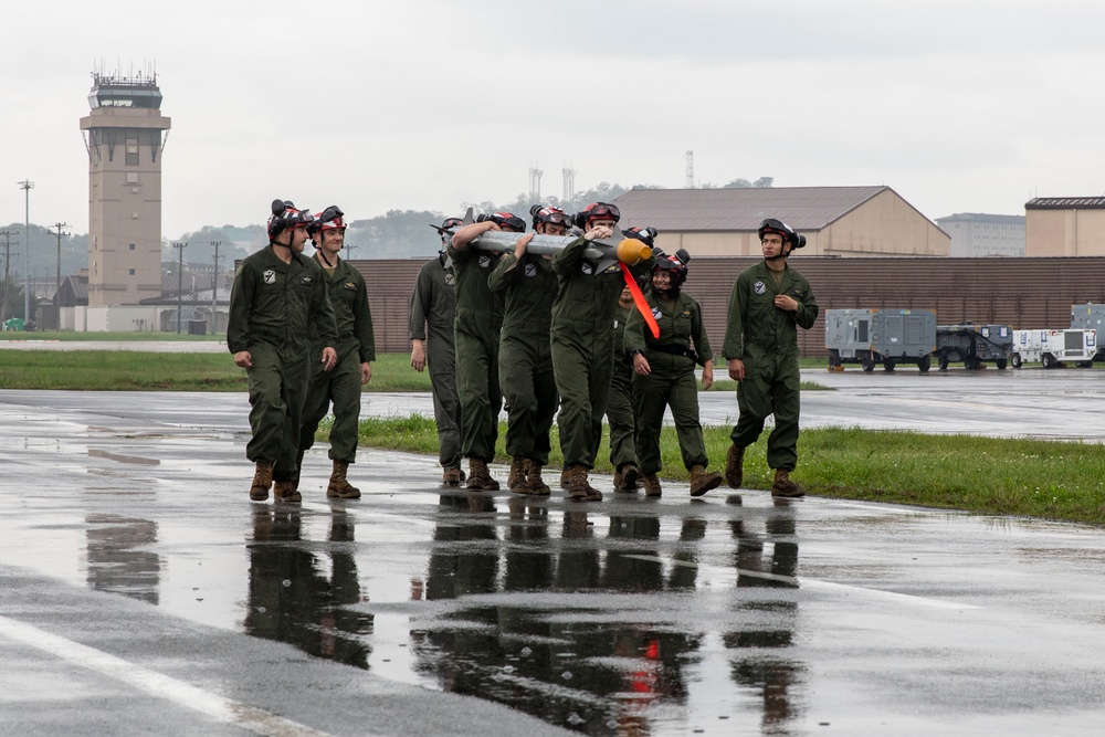 U.S. Marines load ordnance onto F-35B