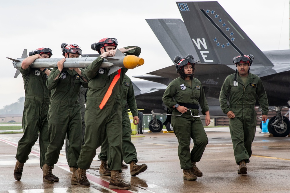 U.S. Marines load ordnance onto F-35B