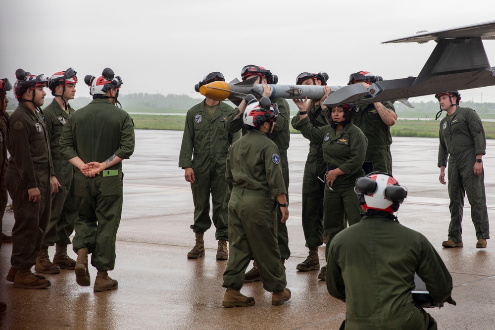 U.S. Marines load ordnance onto F-35B