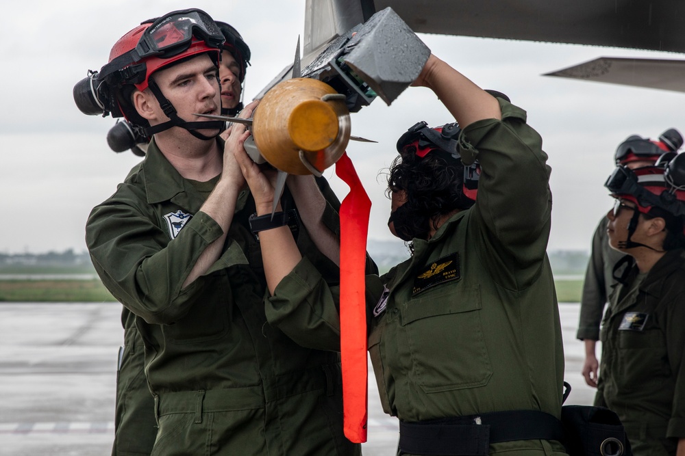U.S. Marines load ordnance onto F-35B