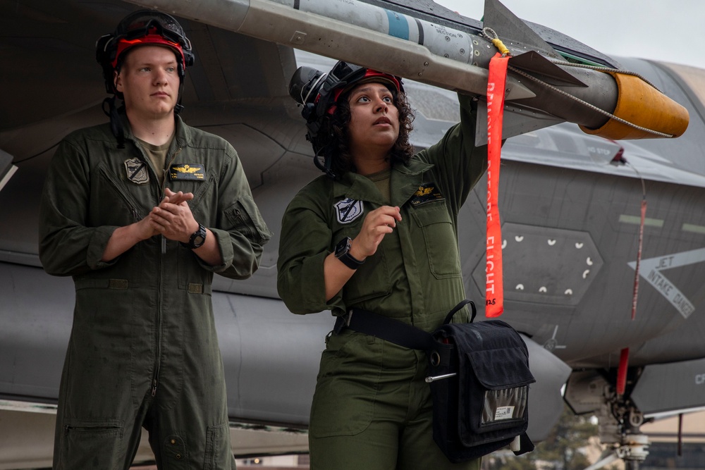 U.S. Marines load ordnance onto F-35B