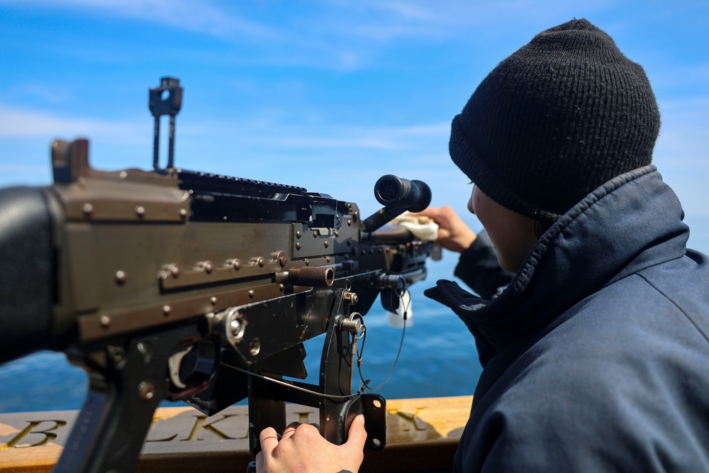 Gunner’s Mate Seaman Trinity Anderson performs a routine maintenance check