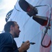 Fire Controlman (AEGIS) 2nd Class Jalen Ross applies primer paint during topside preservation