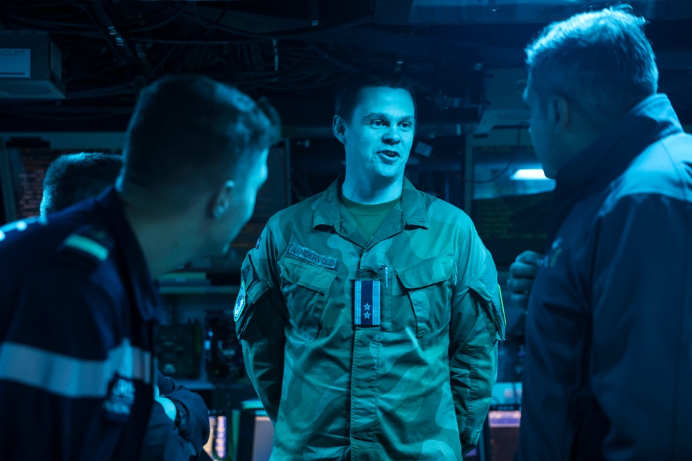 Lieutenant Colonel and Commander Senior Grade (OF4) Atle Lundervold, Norwegian Air Force discusses NATO command and control with Cmdr. Arturo Trejo