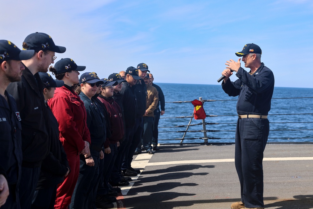 Capt. Michael Dwan, commodore, Combined Task Force (CTF) 64 delivers remarks to the crew of the USS Bulkeley (DDG 84)