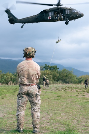 A MV-22 Osprey supporting USAID and JTF-Haiti delivers aid supplies in Troirac
