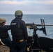Gunner’s Mate 2nd Class Joshua Cvitic fires an M2A1 50-caliber gun