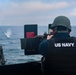 Gunner’s Mate 2nd Class Joshua Cvitic fires an M2A1 50-caliber gun