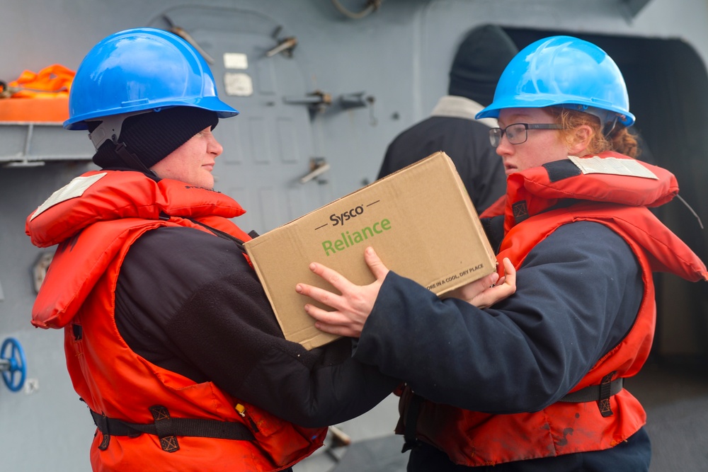 U.S. Navy Sailors unload cargo while conducting a replenishment-at-sea during Formidable Shield 2025